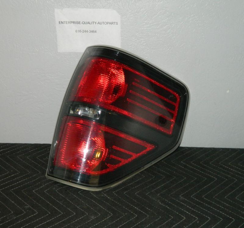 Oem 2009-2014 ford f-150 right/passenger side tail light assembly *black*