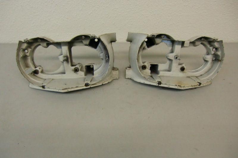 1964 cadillac pair headlight buckets head light front housing trim molding