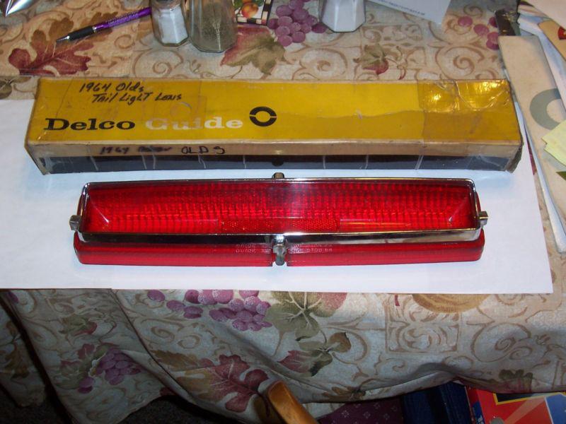 Nos oldsmobile 1964 tail lamp lens and chrome bezel d88 s88 j88 js1 r or l side 