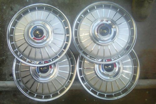 1962 ford fairlane 14 inch hub caps in good condition!