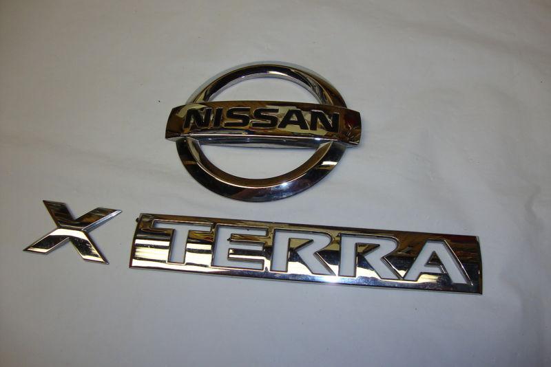 Nissan xterra chrome gate emblems oem