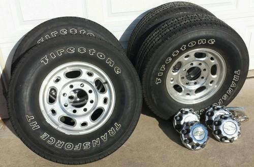 2006 chevy 8 lug rim and tire package. center caps and lugs included. 