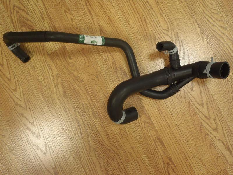 Land rover lower radiator hose discovery 2- oem brand new 