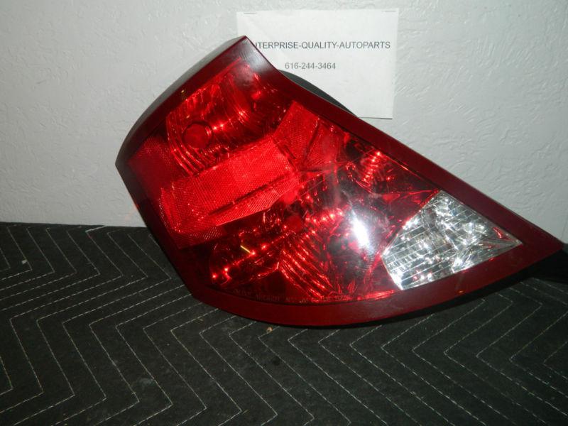 Oem 2003-2007 saturn ion left / driver side tail light assembly