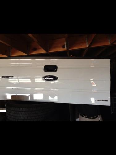 2010 to 2013 ford tailgate for sale with black interior. new!