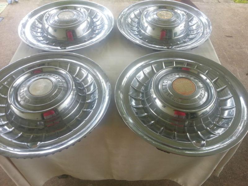 1958 cadillac hub caps - set of 4