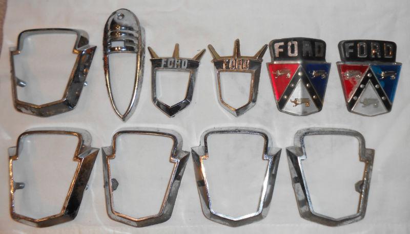 Vintage ford emblem and bezel lot 7 bezels 2 emblems