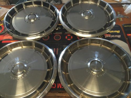 1972 ford mustang hub caps. set of 4.