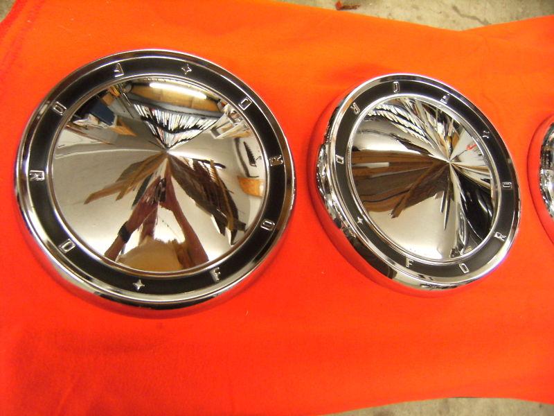 1960  ford  dog dish hubcaps.  a pair in nice condition