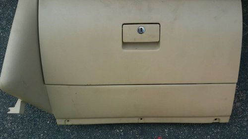 1999-2005 volkwagen jetta glove box, tan  in color