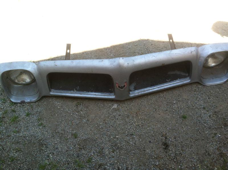 1976 trans am front head light clip