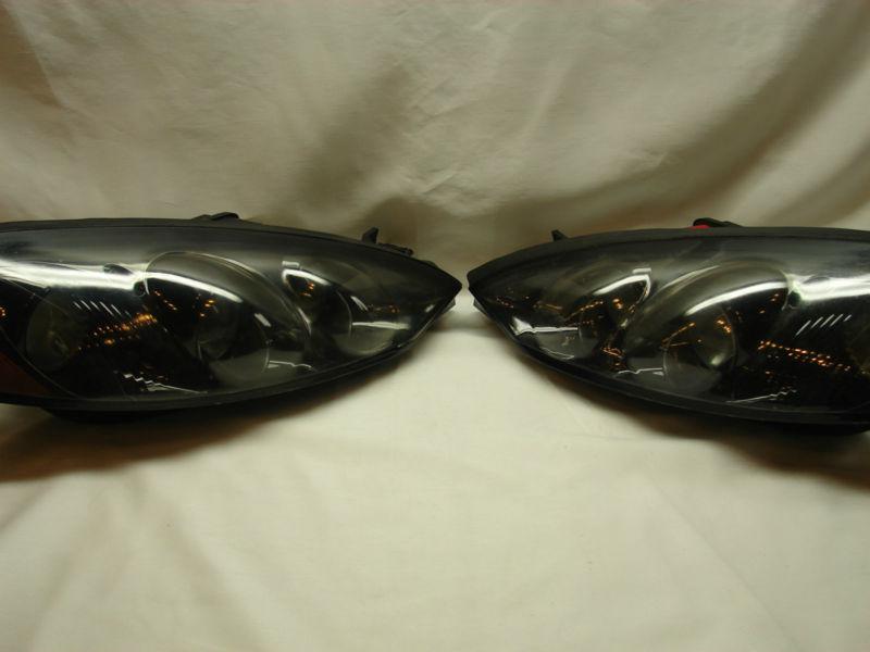 Pair of 1999 - 2000 mercury cougar headlights