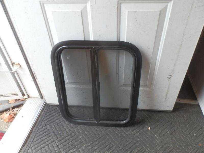 Rv black tinted slider window r.o. 22" tall x 18" wide 