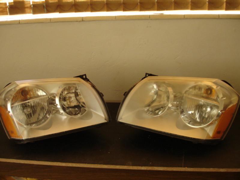 Dodge magnum head lamps drivers & passenger side 05-07 good condition