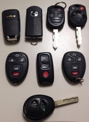 Lot of 8 assorted keyless remotes ford chevy mini mazda gm