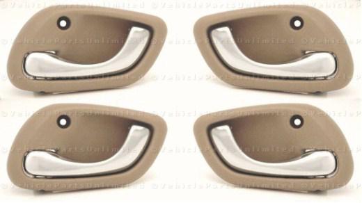 99 - 05 inside  door handles 4 pc (2 left & 2 right)   fits: suzuki grand vitara