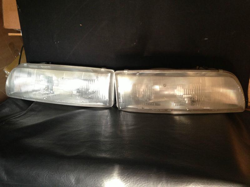 Used oem 91-93 toyota previa left right head lights headlamps 