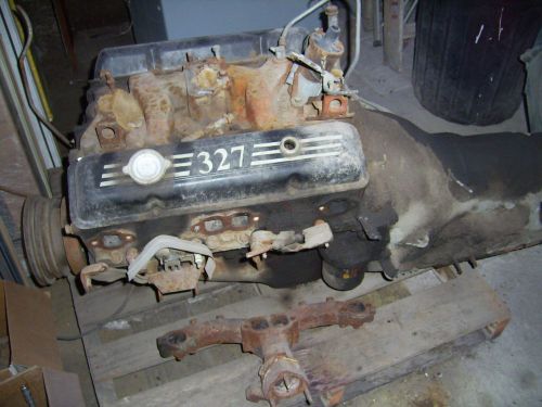 Chevy 327 small block engine complete with exhaust manifolds and transmission