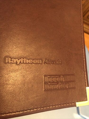 Raytheon aircraft co. (hawker beechcraft 3 ring binder, pockets, maroon, gold