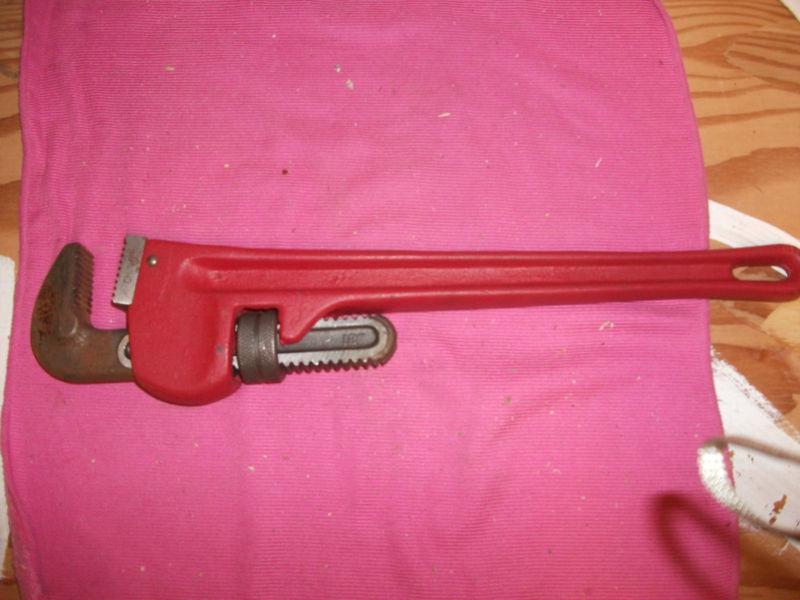 Heavy  duty  18"  cast  metal  pipe wrench. 