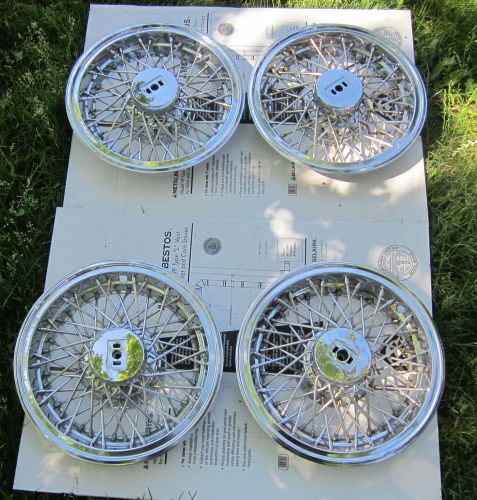 4 nice 1981-1988 oldsmobile cutlass supreme  gm 14 inch wire spoke hubcaps oem