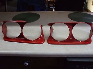 Two original c3 corvette headlight shrouds, metal, left and right