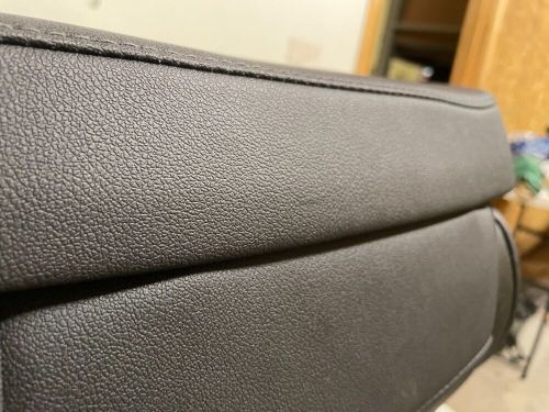 19-23 oem nto silverado ebony leather center jump seat...storage and vents...