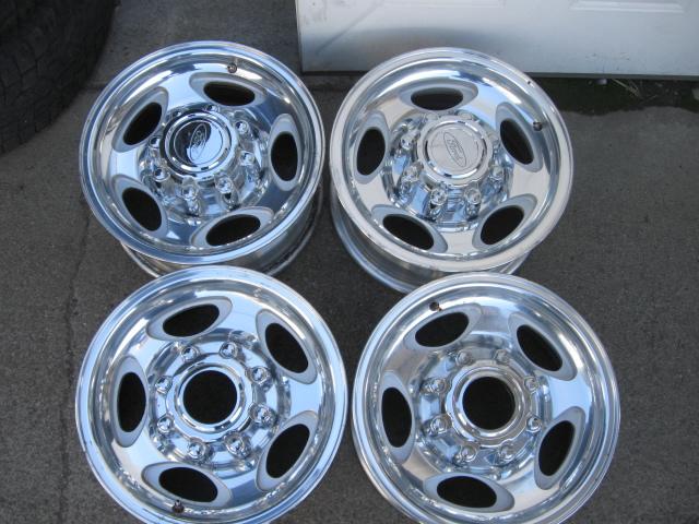 Set of (4) 16x7, fordsd p/u, factory alloy oem wheels with ford logo center caps