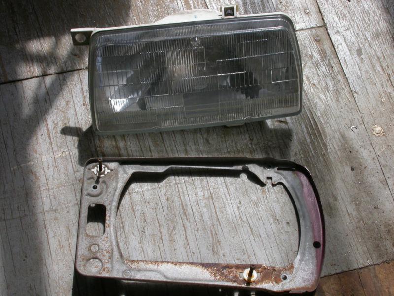 1986 vw golf- jetta headlight with metal mounting ring, drivers side