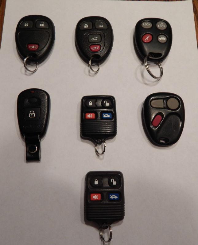 Wholesale lot of 7  "used" keyless remote entry's ~ gm ~ ford & more !!