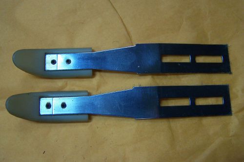 Early model corvair convertible top hold down brackets.