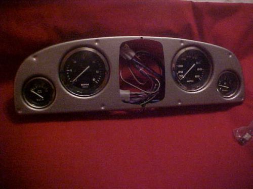 New 4 pc teleflex gauge set, tac, volt, fuel and 65 mph speedo, mercury, wired.