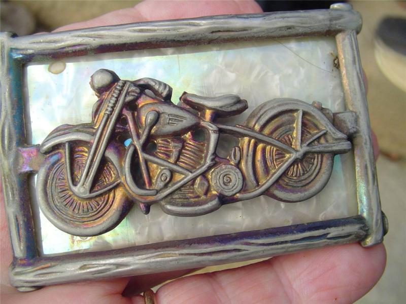 Vintage harley davidson belt buckle featuring a harley/nr