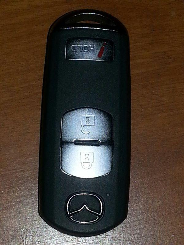 Mazda smart key keyless remote fob transmitter 3 buttons wazx1t763ske11a03