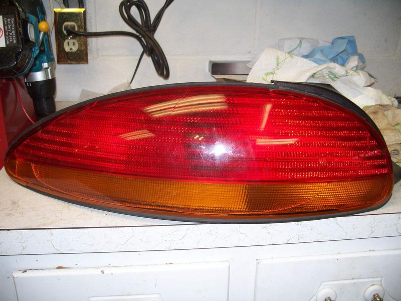 1999-2004 chrysler lhs & concorde - oem left tail light parts broken hardware