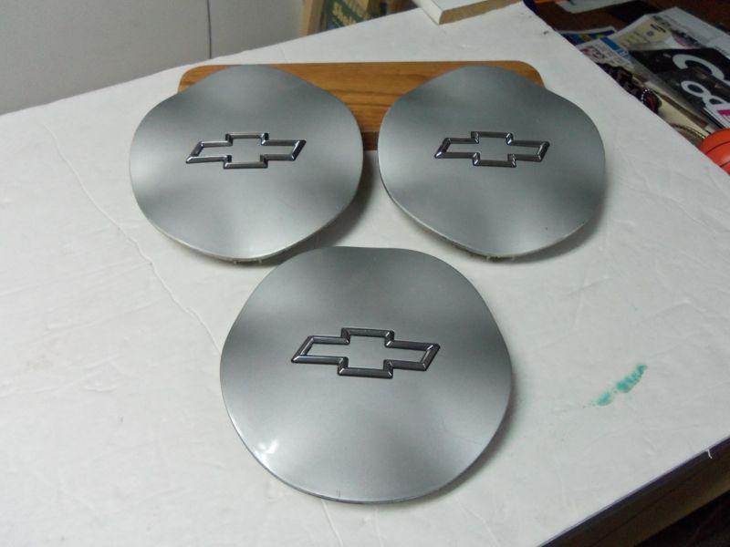 (3) hubcap centers for 1994 up chevrolet monte carlo; used...