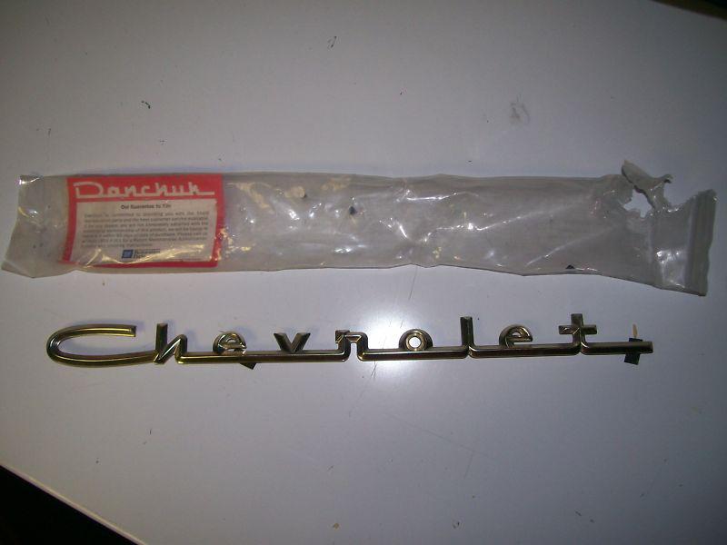 1955 56 57 chevrolet gold trunk script molding danchuck