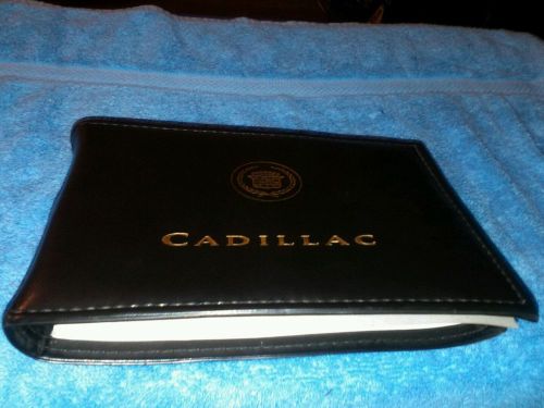 2000 cadillac deville  owners manual and leather holder