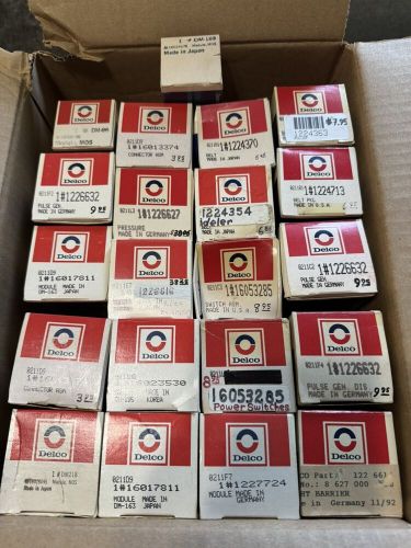 Vintage lot of delco radio parts 21 delco boxes modules, switches, belts, etc