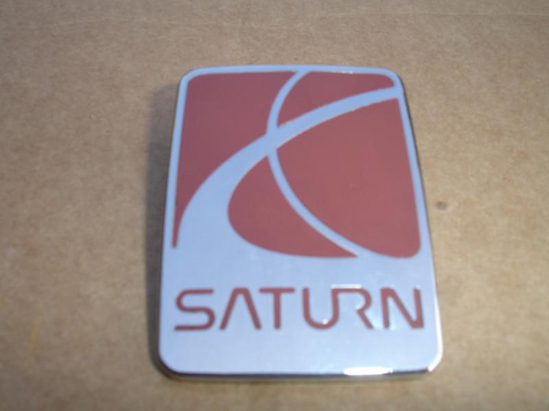 Saturn oem fender, or bumper emblem 2 1/2" x 1 7/8" x 1/8"