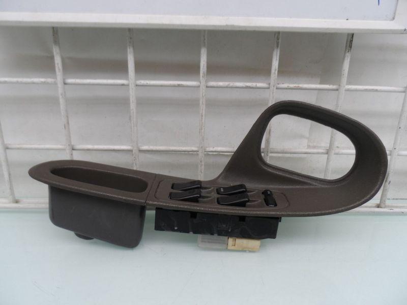 Master window switch panel with bezel "tan and gray available" mazda 626 1996