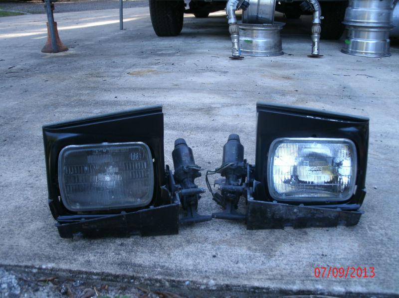 1982-90 firebird trans am headlight bucket assemblies complete working lft + rt