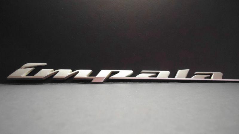 Used genuine gm chevy "impala" nameplate emblem fits front side door or trunk 