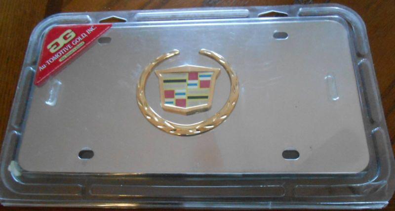 Cadillac logo emblem name on polished stainless steel license plate nip