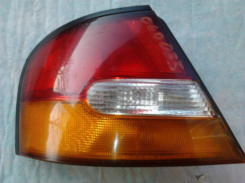 1998 / 99 nissan  altima driver side / left rear tail signal,marker, brake lamp