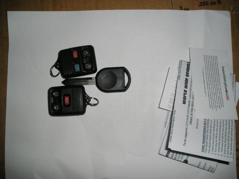 2 ford keyless remote fob and 1 uncut ignition transponder chip key