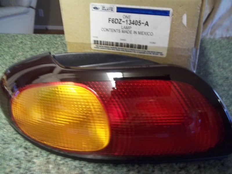 97 ford taurus tail light/lamp-  driver/left side nib- oem