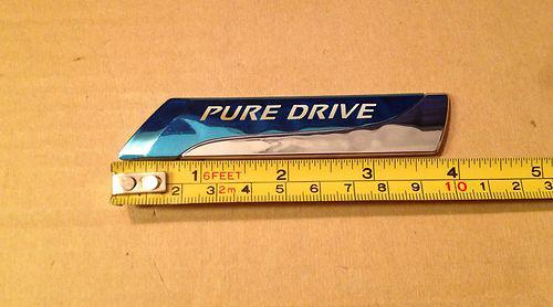 Used genuine oem nissan "pure drive" emblem 90892-bg00a