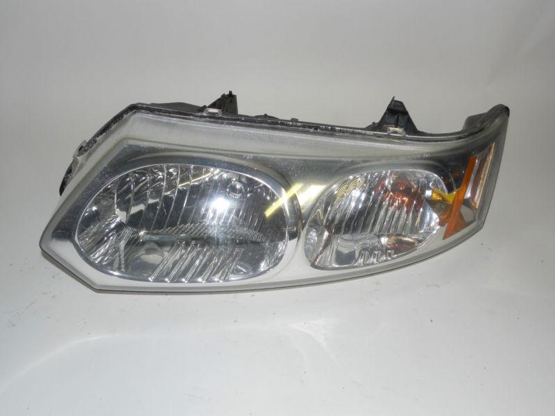 03 04 05 06 07 saturn ion sedan oem left headlight nice!