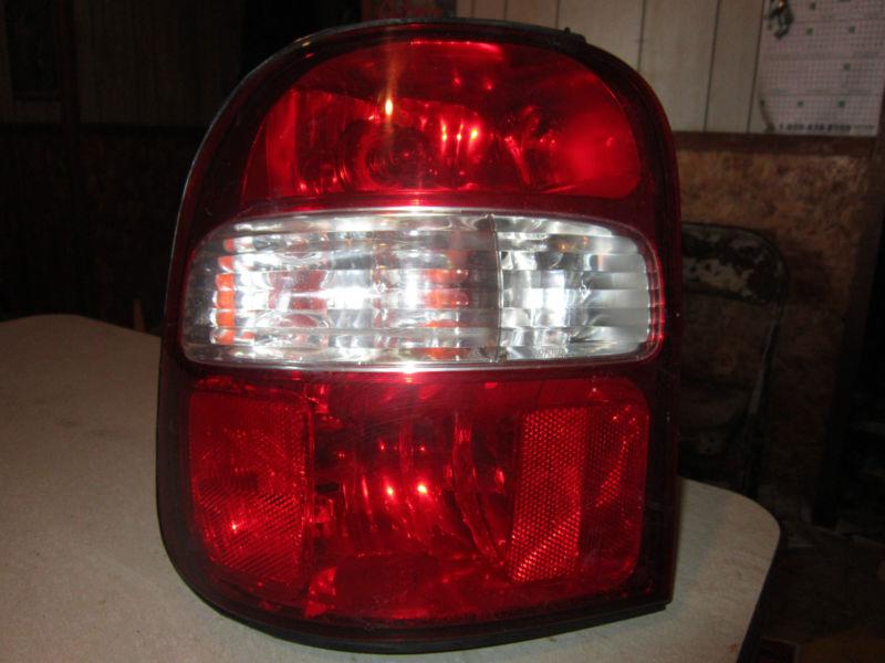 98-02 kia sportage  driver, left  side tail light 